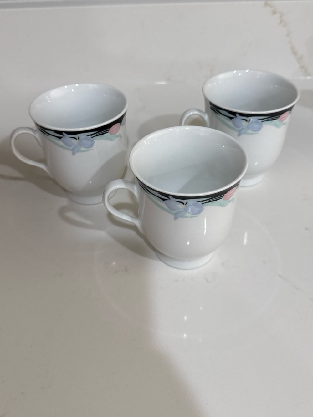 White Porcelain Tea Cup Set with Pastel Floral Trim - Set of 3